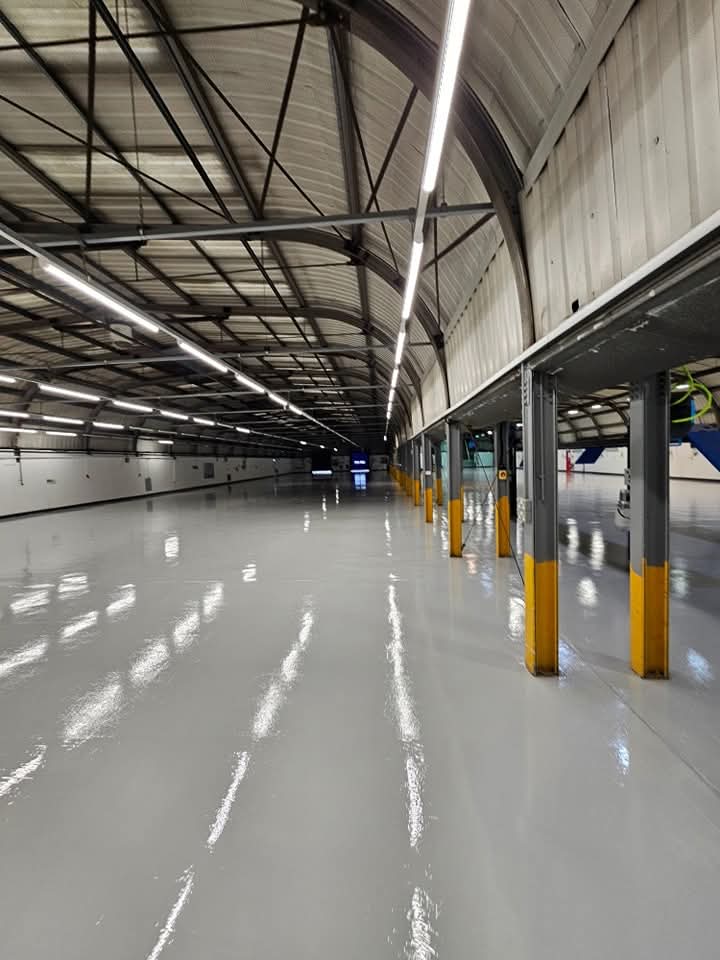 Industrial epoxy flooring system installed for a warehouse or factory environment