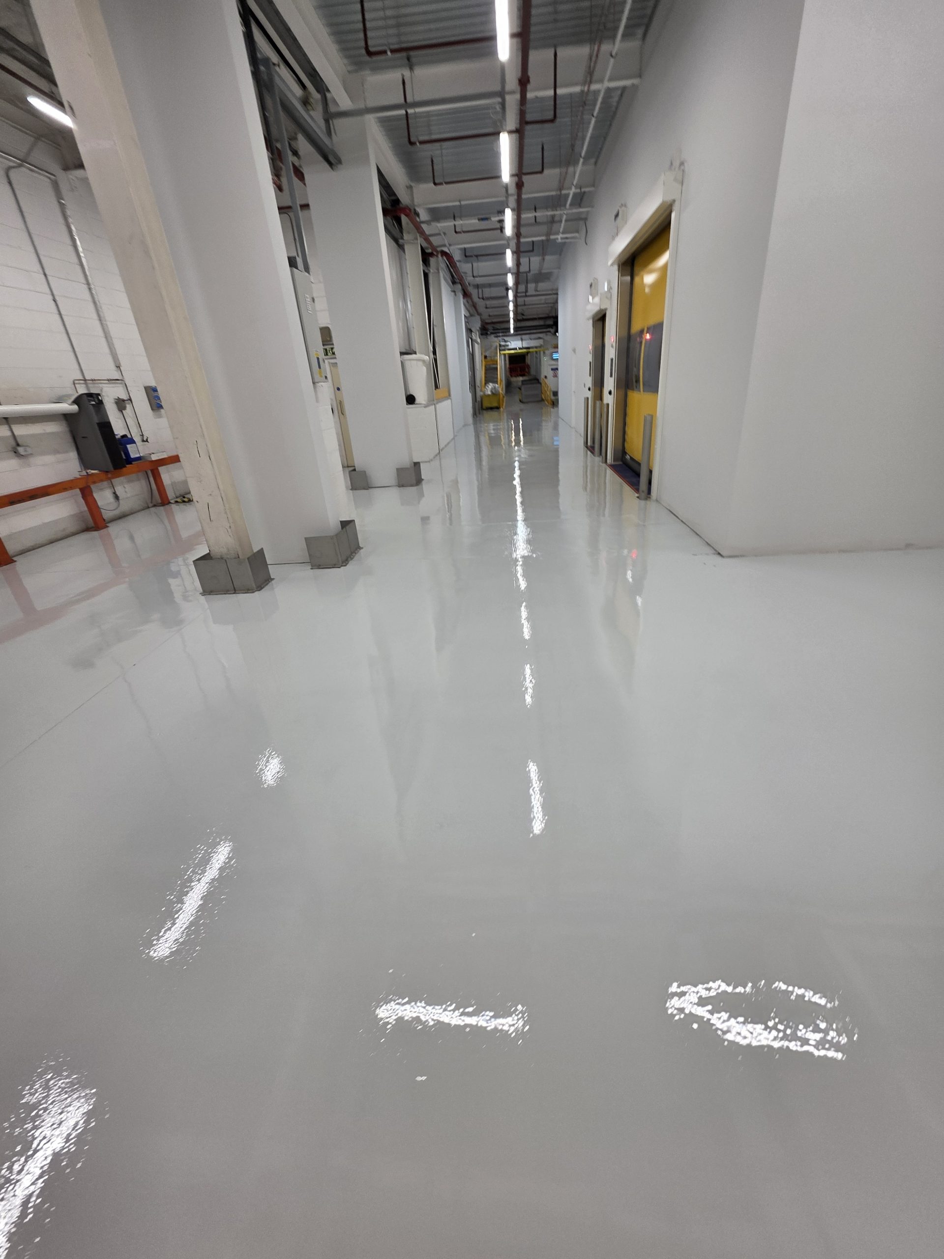 Resin floor coating for a workshop or industrial unit