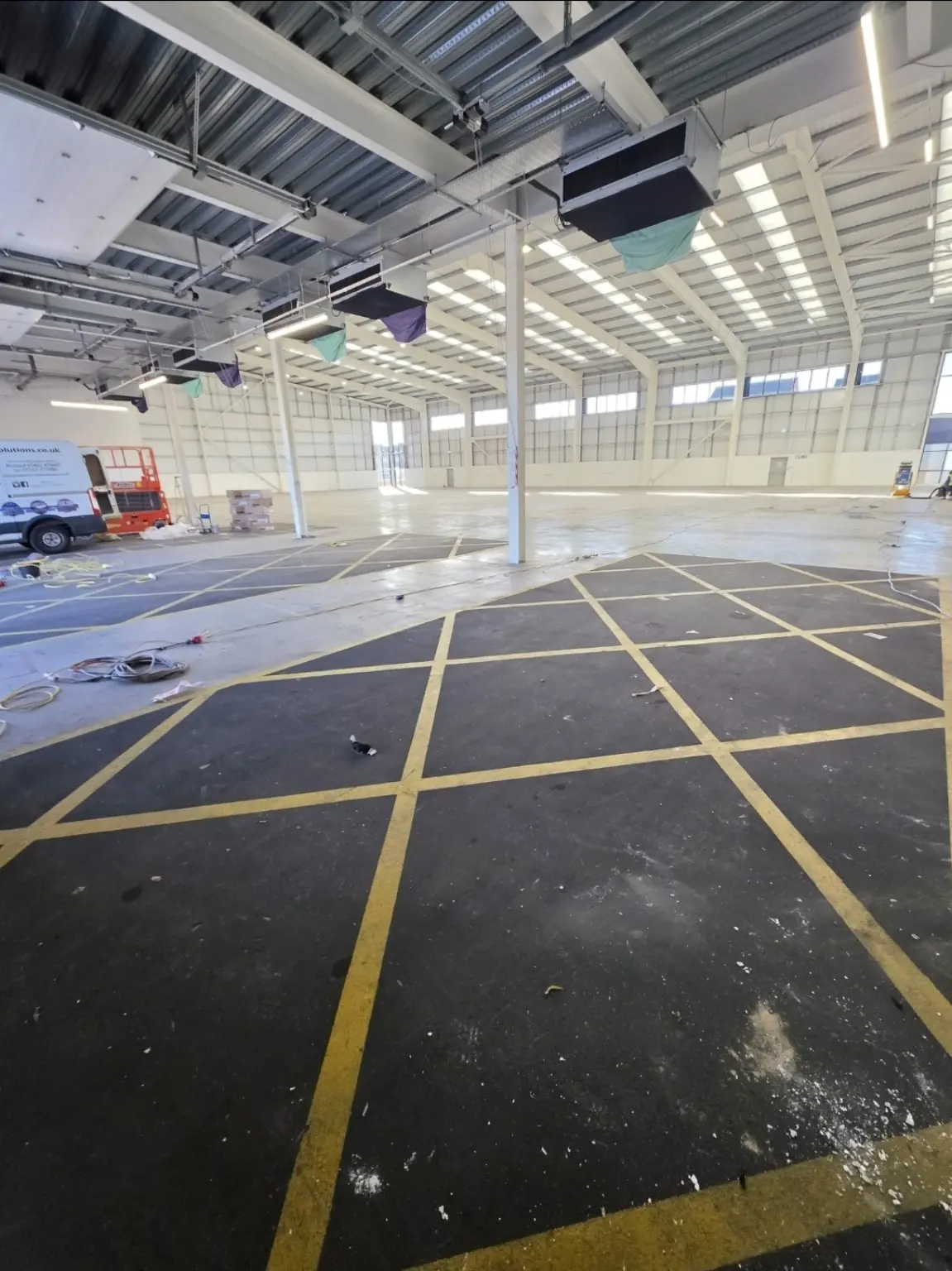 Damaged existing resin flooring in Bristol warehouse