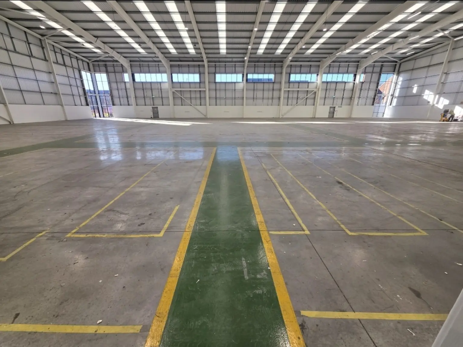 Warehouse resin floor before mechanical preparation in Bristol