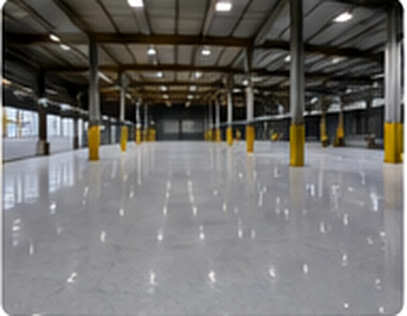 Modern industrial resin flooring installed in a warehouse environment