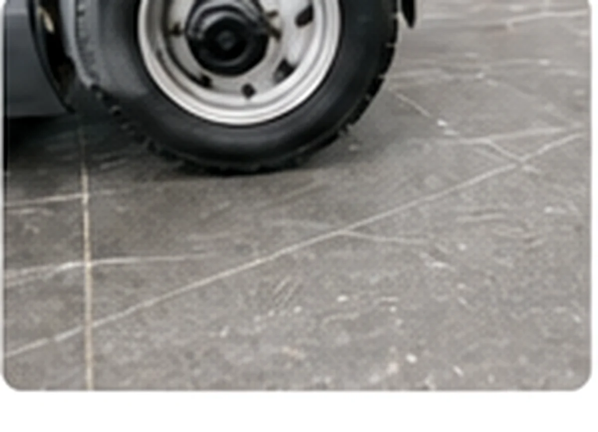 Close-up of surface scratches and wear on a resin floor