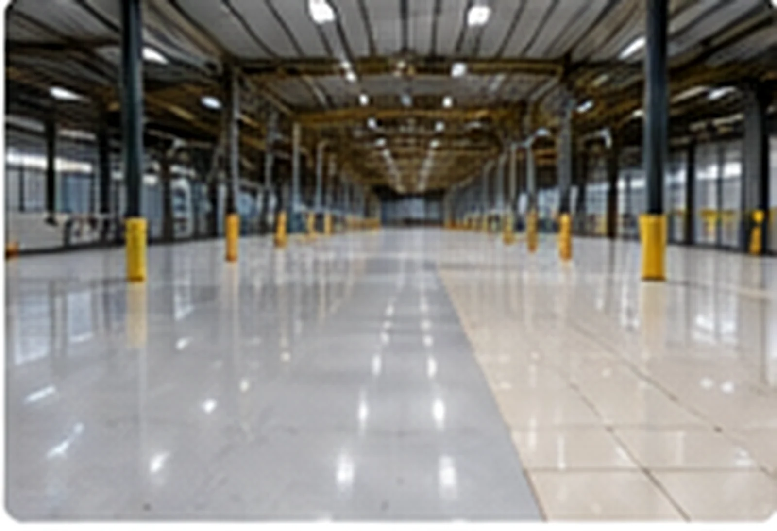 Resin flooring and tiled floor comparison in an industrial warehouse