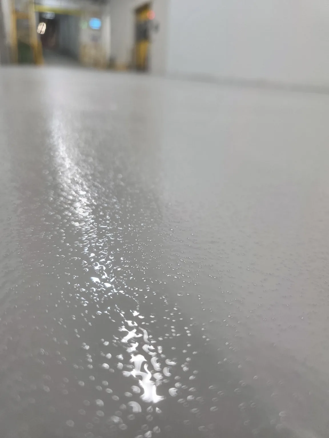 Close-up of textured high-build epoxy factory floor coating