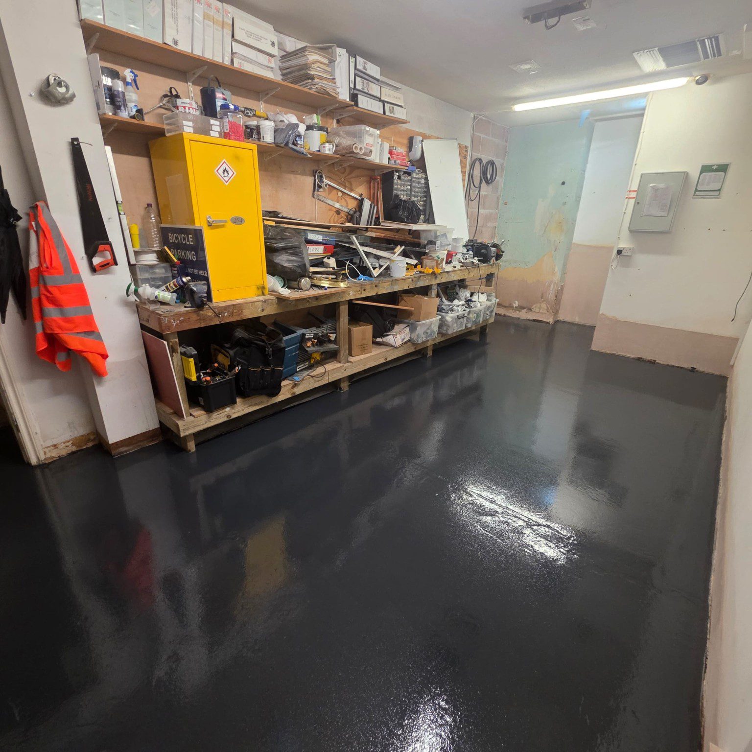 Dark commercial resin flooring in Novotel maintenance and service room