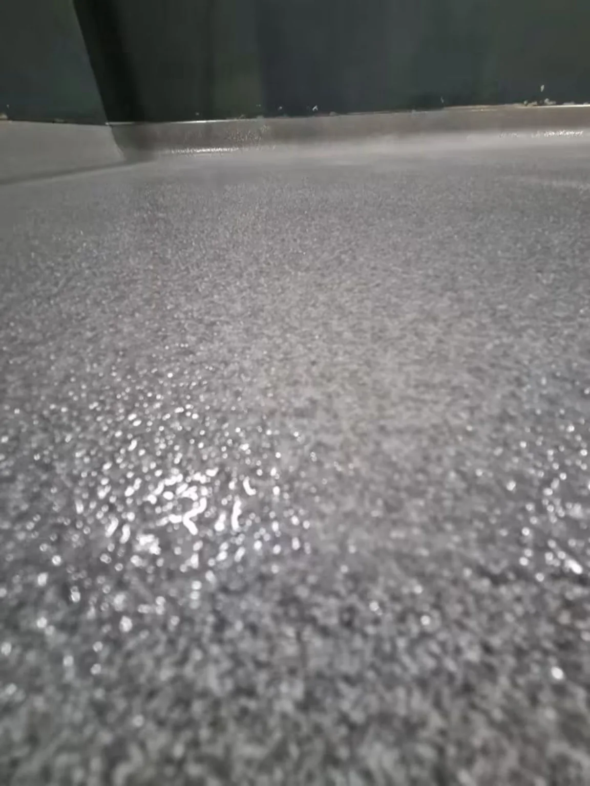 Wet anti-slip resin floor close-up showing textured finish at Village Hotel Bristol