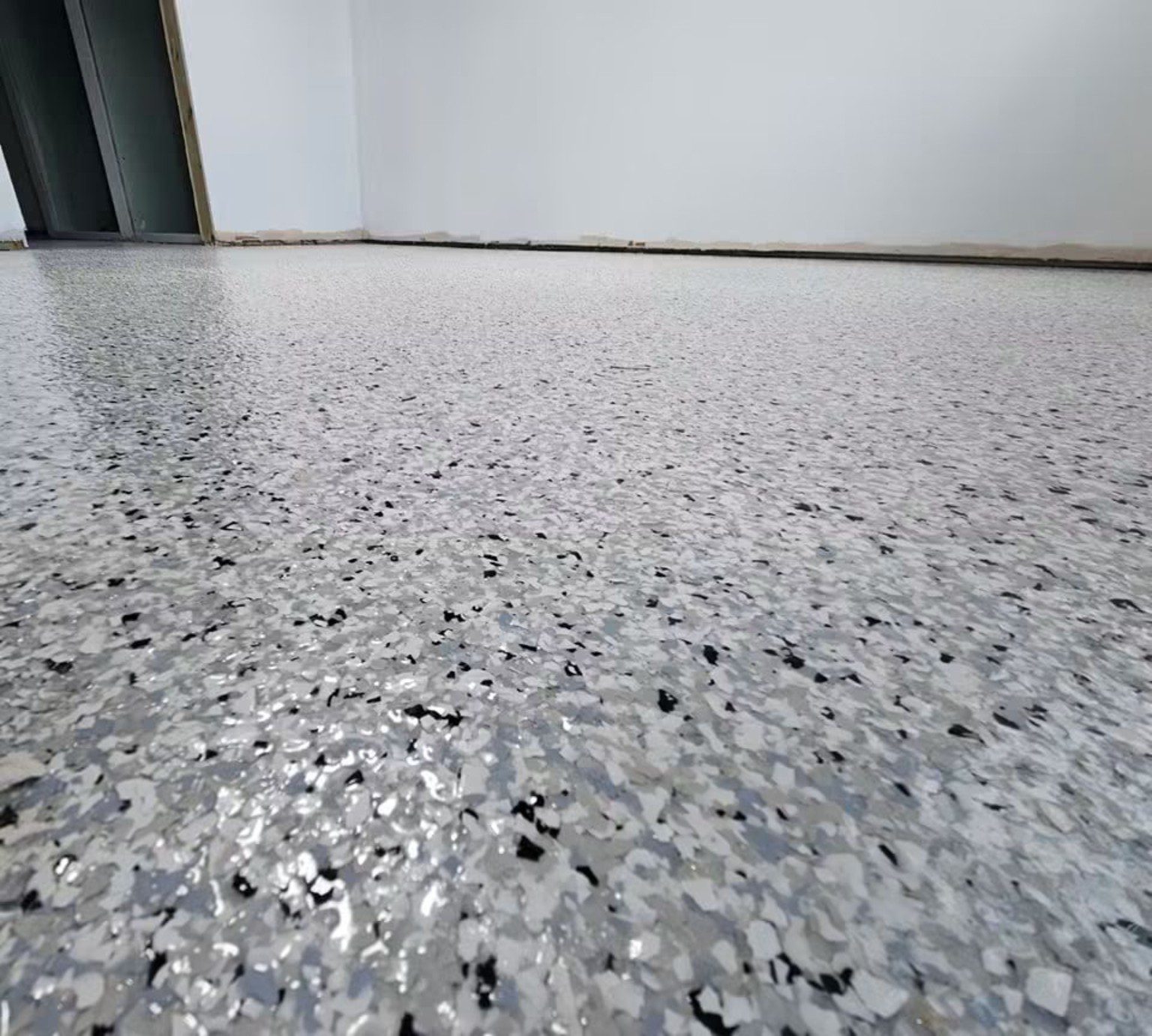 Completed grey and white speckled MMA resin floor in a Cardiff commercial interior.