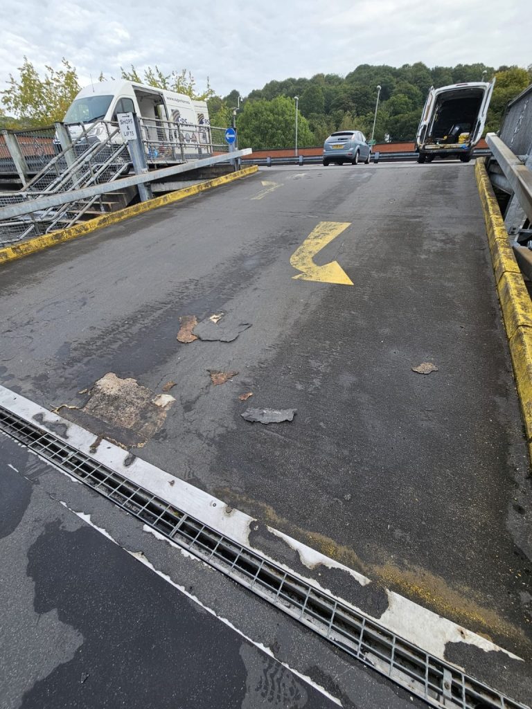 Worn existing car park ramp surface before refurbishment in South Wales